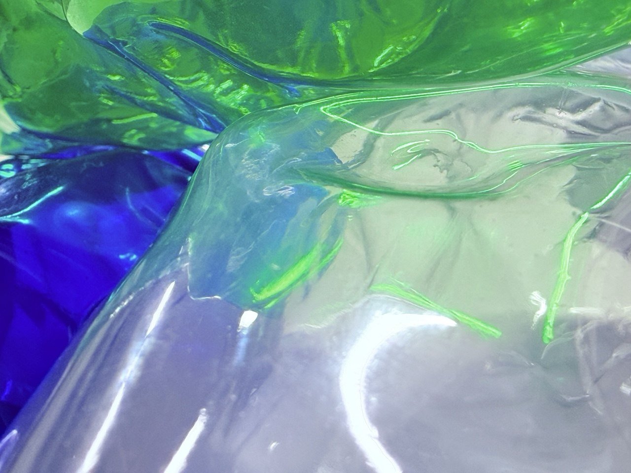 Collected PET — Sapphire, Emerald, and Crystal water-bottle fragments before processing