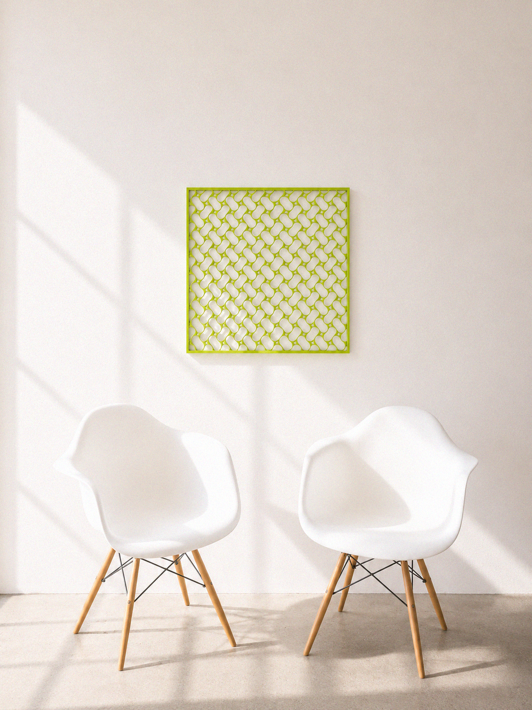 ORIGEN sculptural 3D tile installed above two Eames chairs in a sunlit room